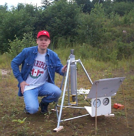 Author with rocket in test stand